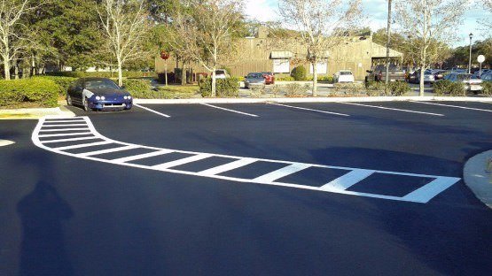 asphalt parking lot crosswalk painting and stripes