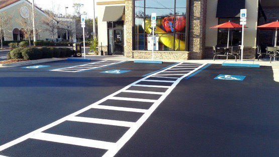 asphalt seal coat and stripe handicap parking spaces