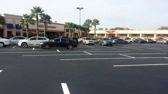 parking lot plaza asphalt seal and stripe Orlando Florida